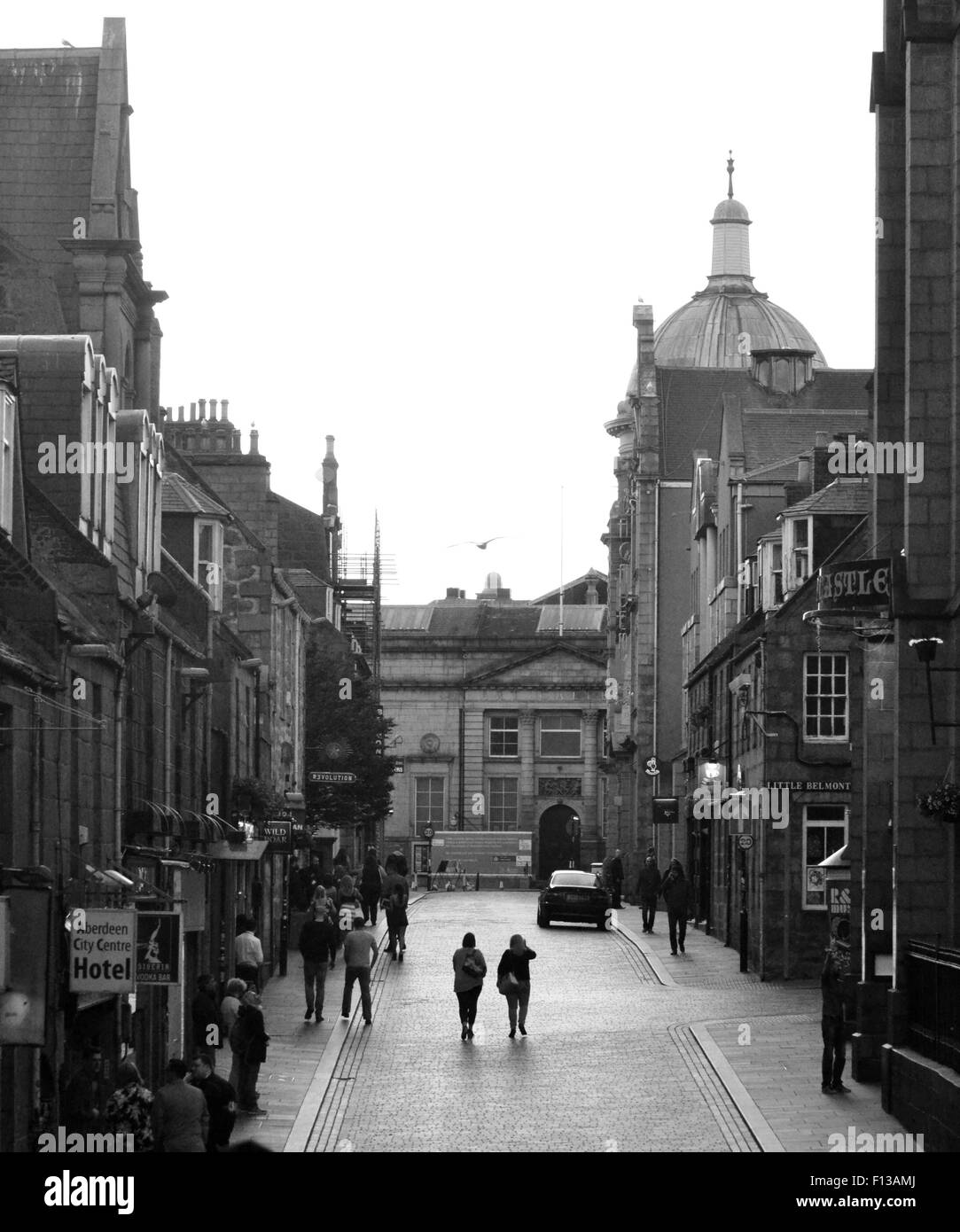 Black and White picture of Belmont Street in Aberdeen as the sun begins to set giving an eerie feel Stock Photo