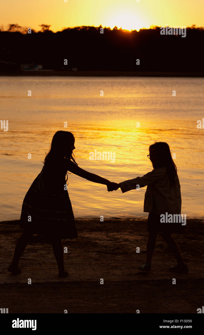 Silhouette Of Two Girls At Sunset High Resolution Stock Photography And Images Alamy