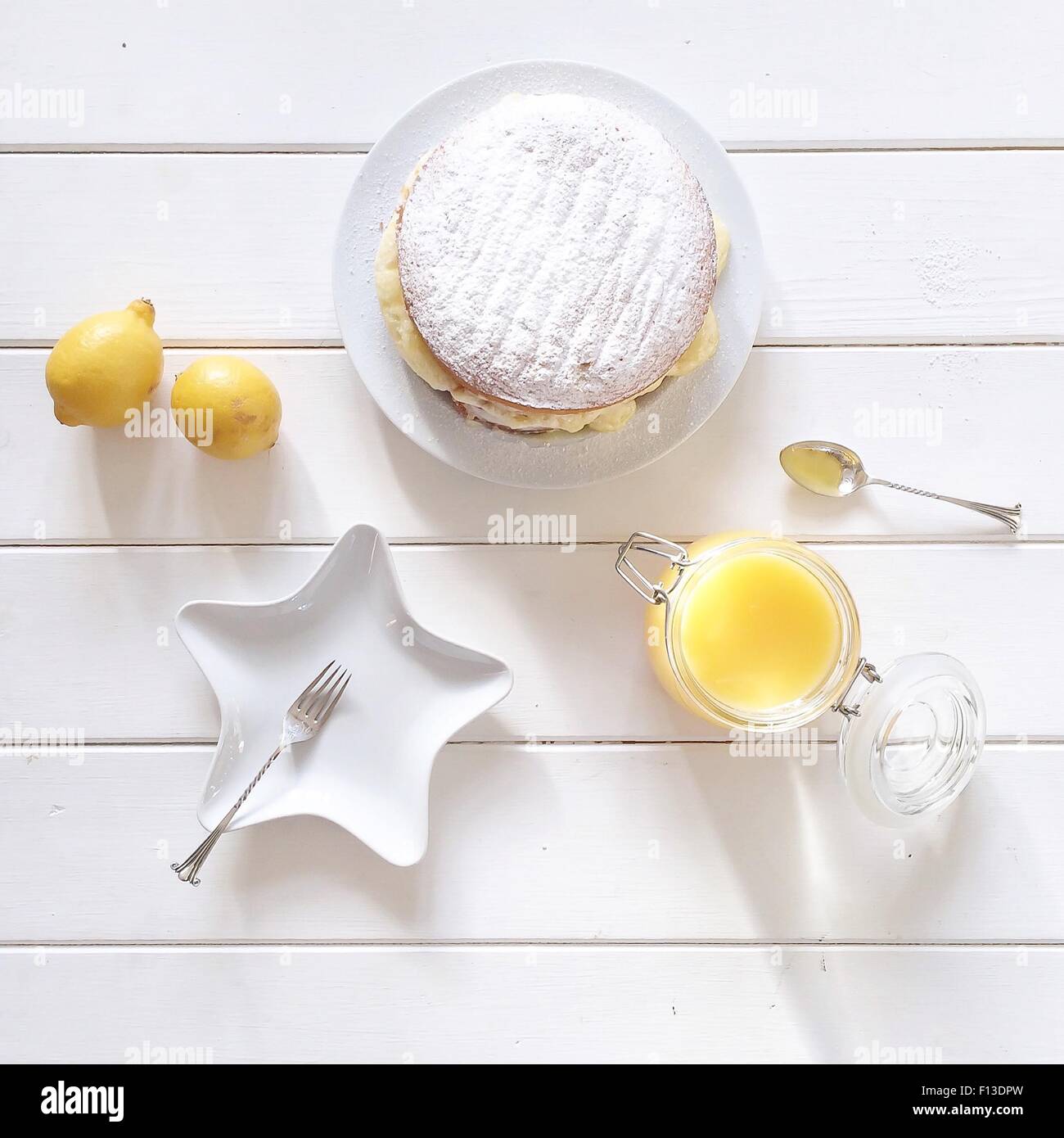 Lemon cake with lemon curd and lemons Stock Photo
