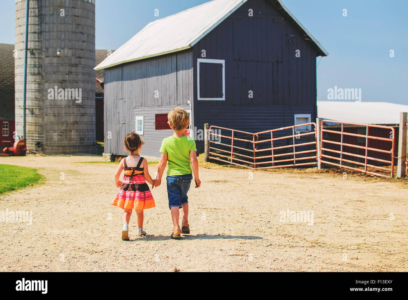 Boy and girl walking holding hands hi-res stock photography and images ...