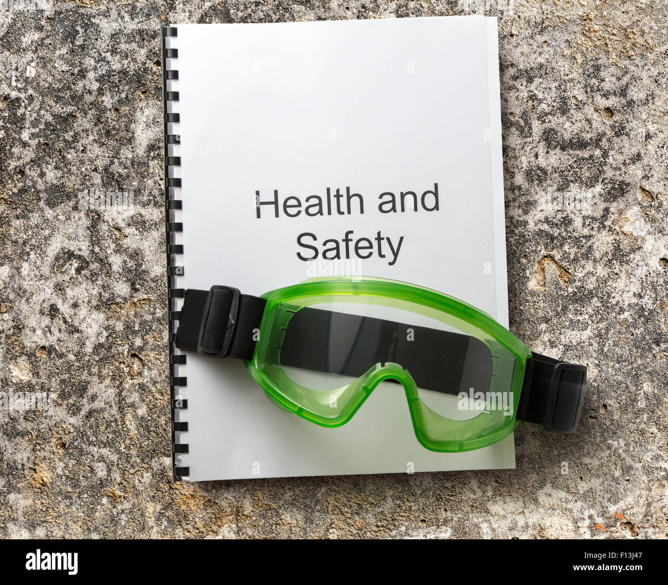 Health and safety register with goggles in closeup Stock Photo