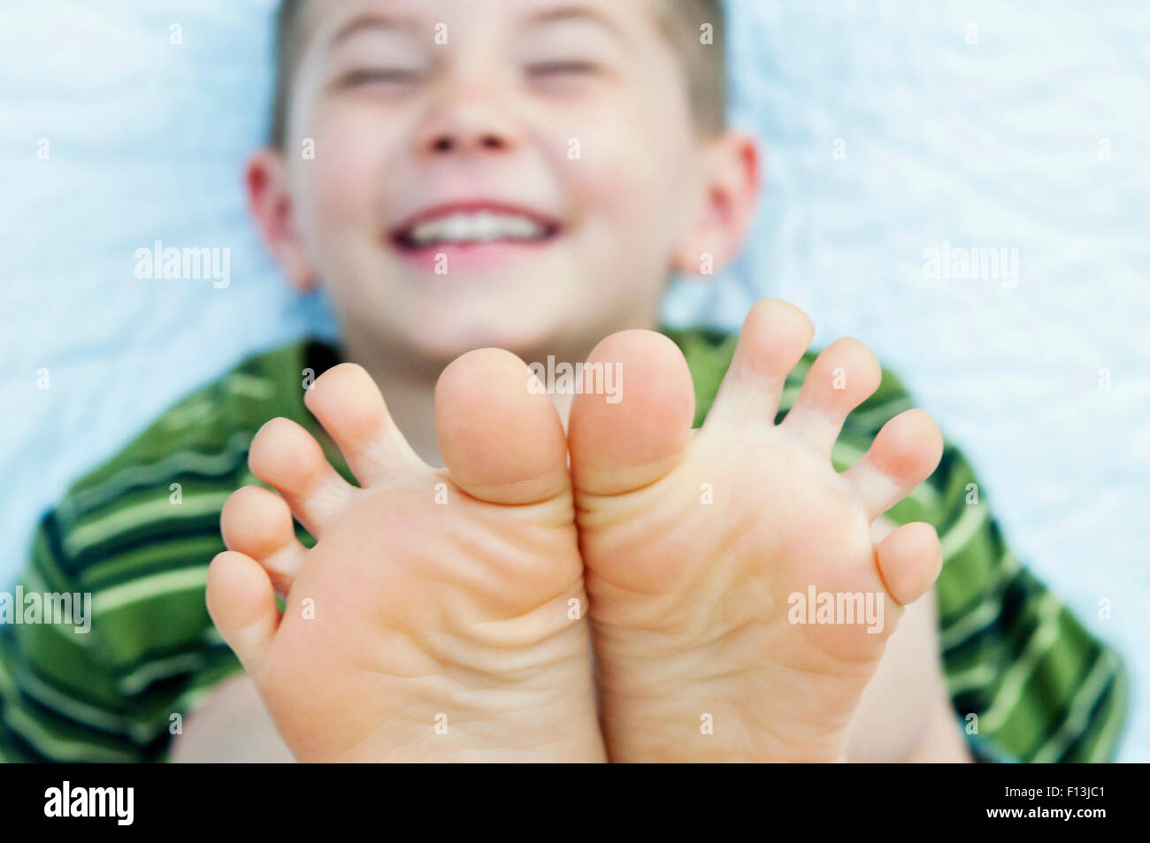 Boy smiling toes Stock Photo