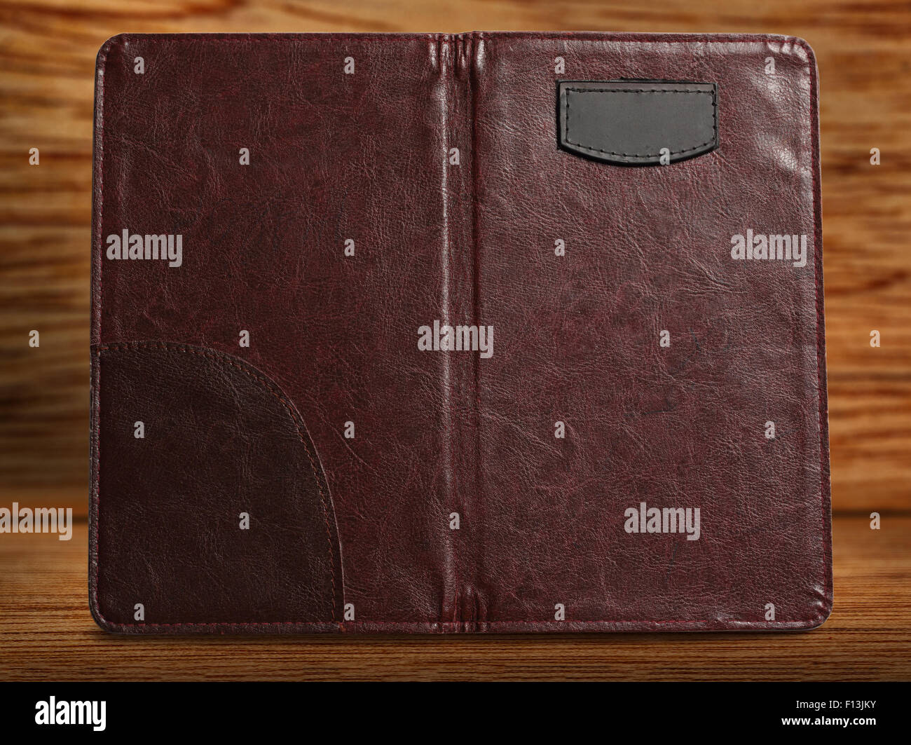Empty brown folder on wooden background closeup Stock Photo