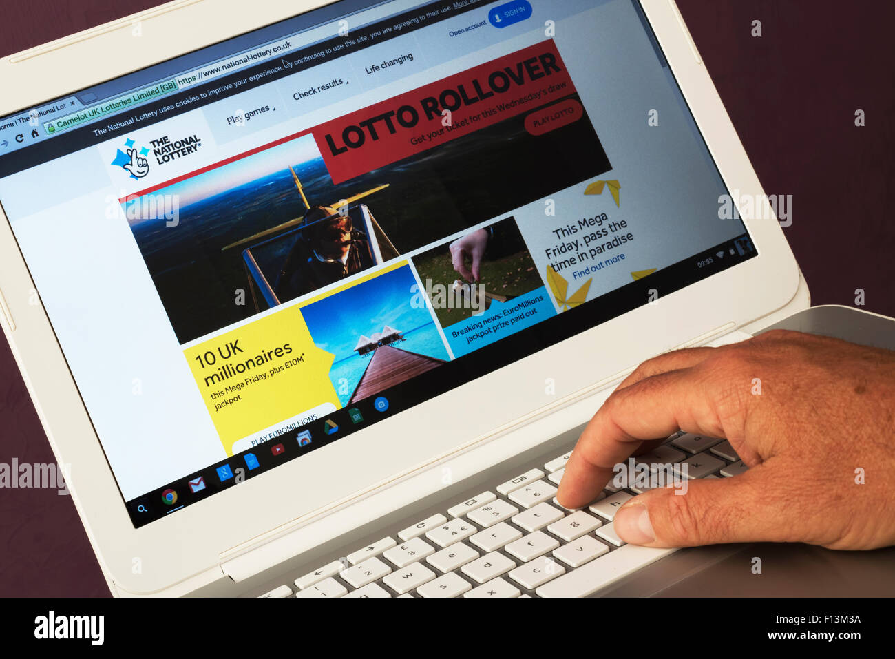 Website belonging to the National Lottery being viewed on a laptop computer Stock Photo