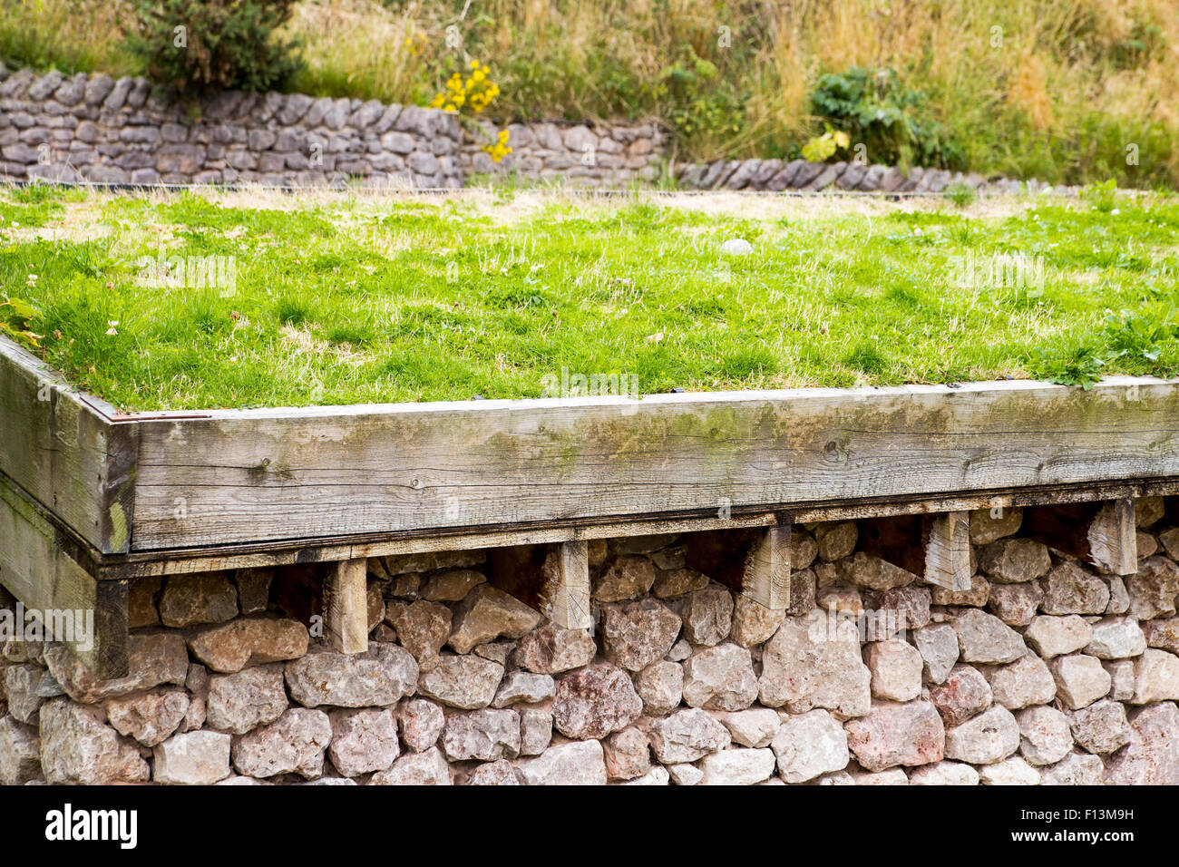 A green roof, or a living roof on top of a stone building Stock Photo