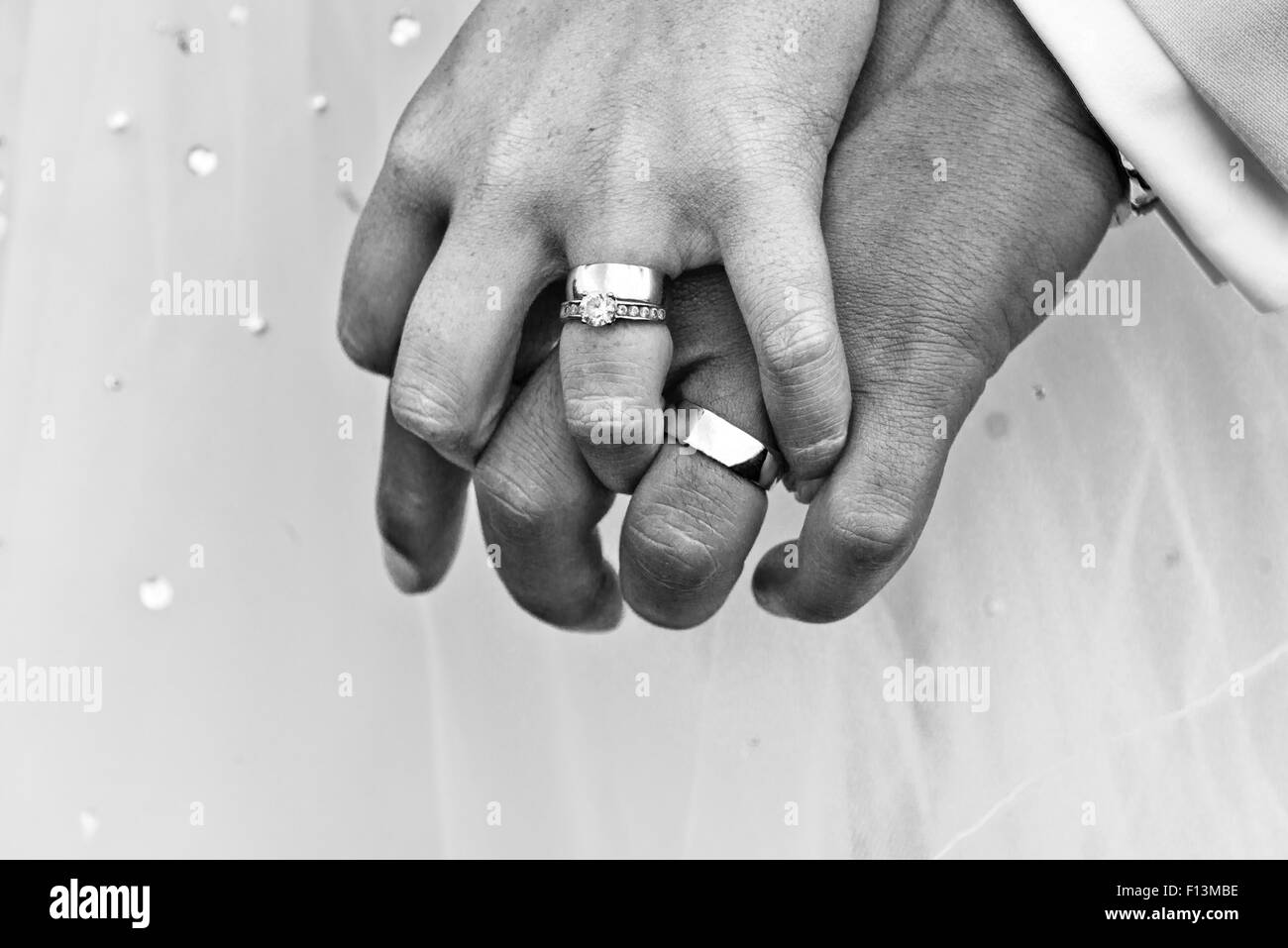 The bride groom proudly showing off their wedding rings after the