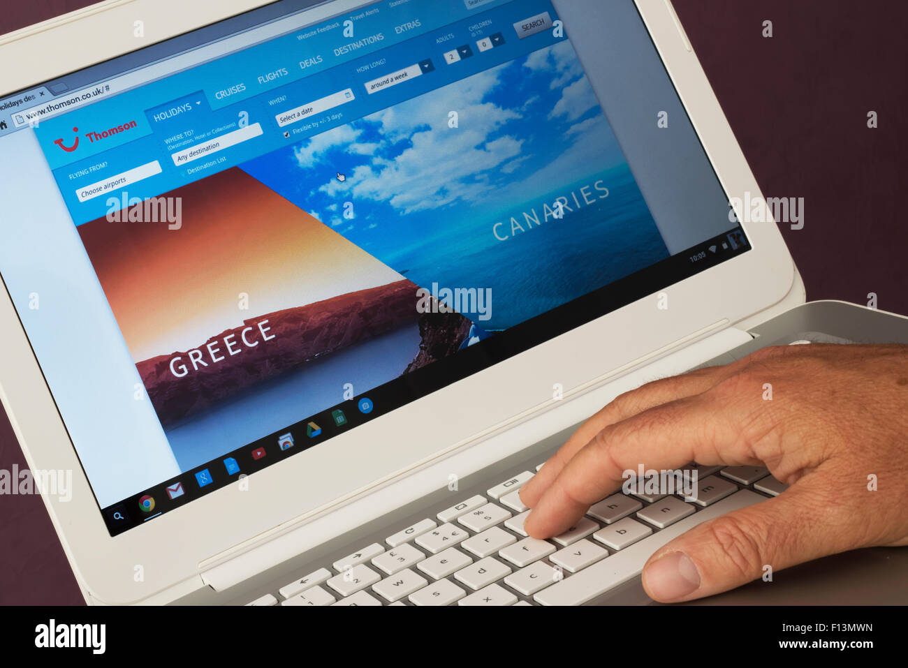 Website belonging to Thomson Holidays being viewed on a laptop computer Stock Photo