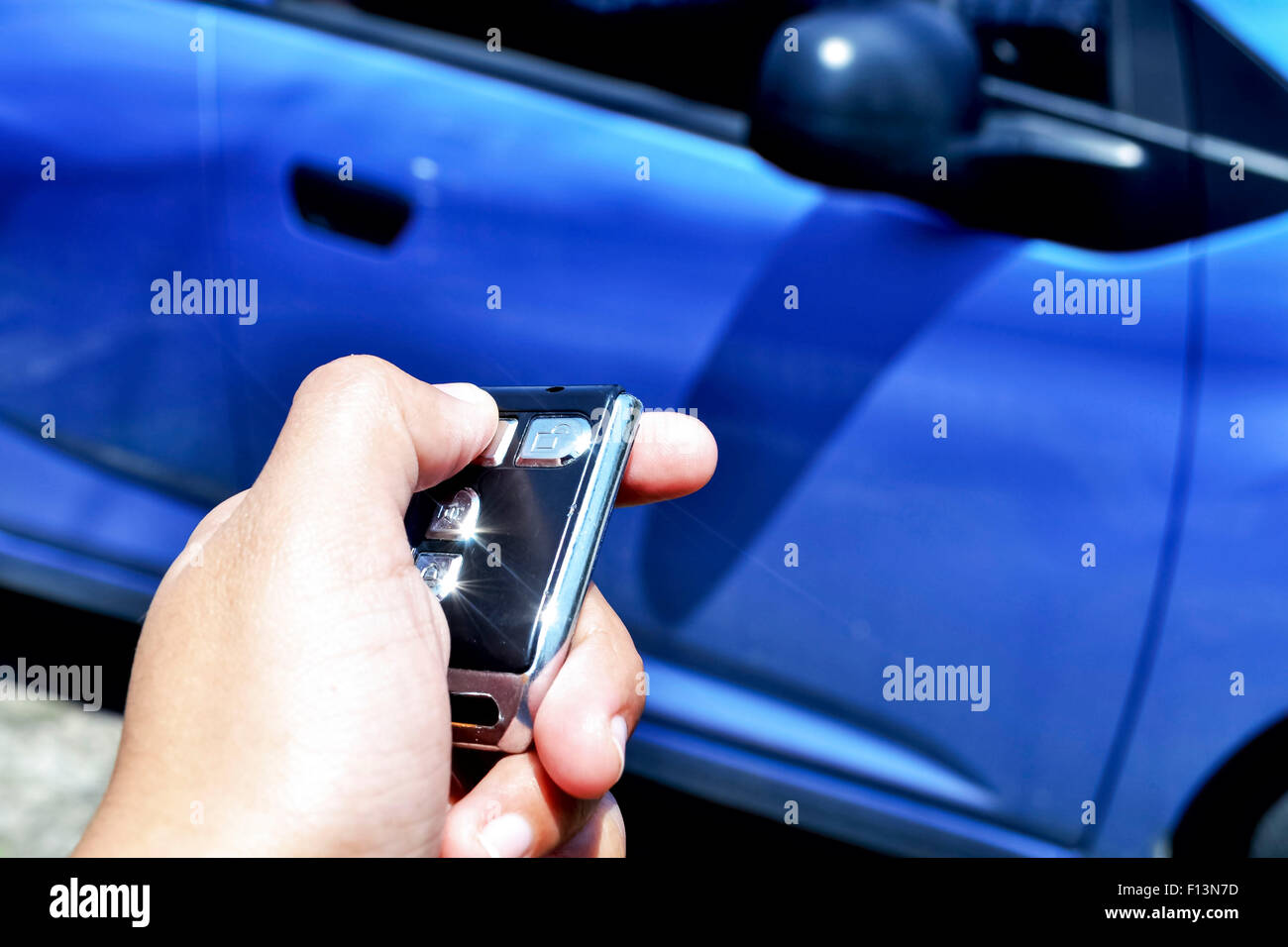 Hand holding car remote Stock Photo