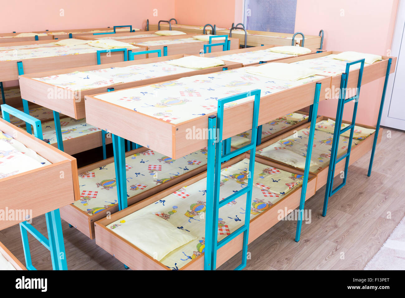 Kindergarten bedroom with small bunk beds with stairs for the kids