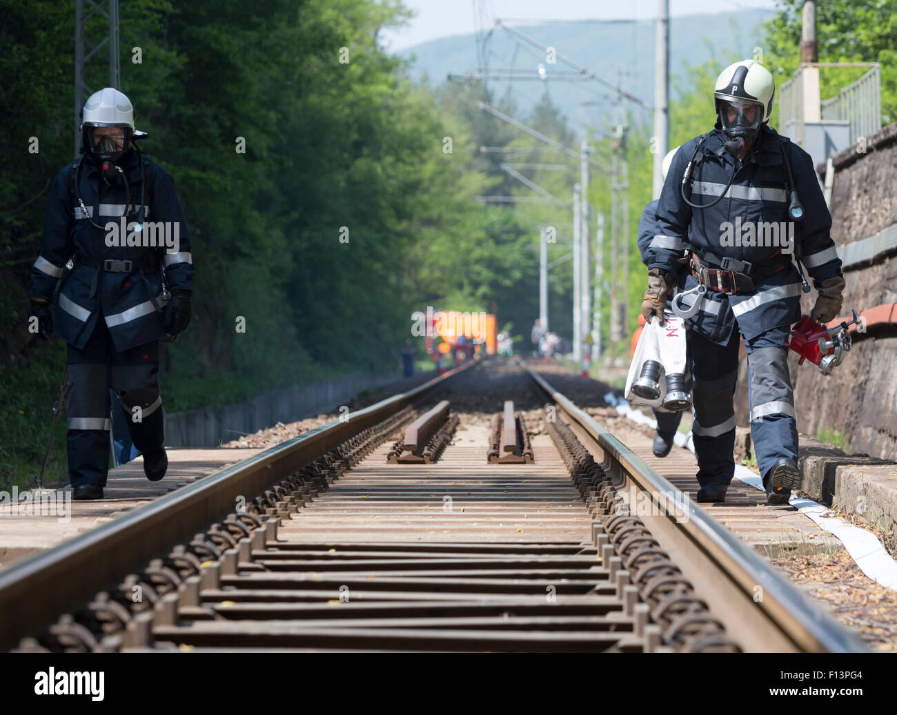 Sofia, Bulgaria - May 19, 2015: Firefighters are approaching a chemical cargo train crash near Sofia, Bulgaria. Teams from Fire  Stock Photo