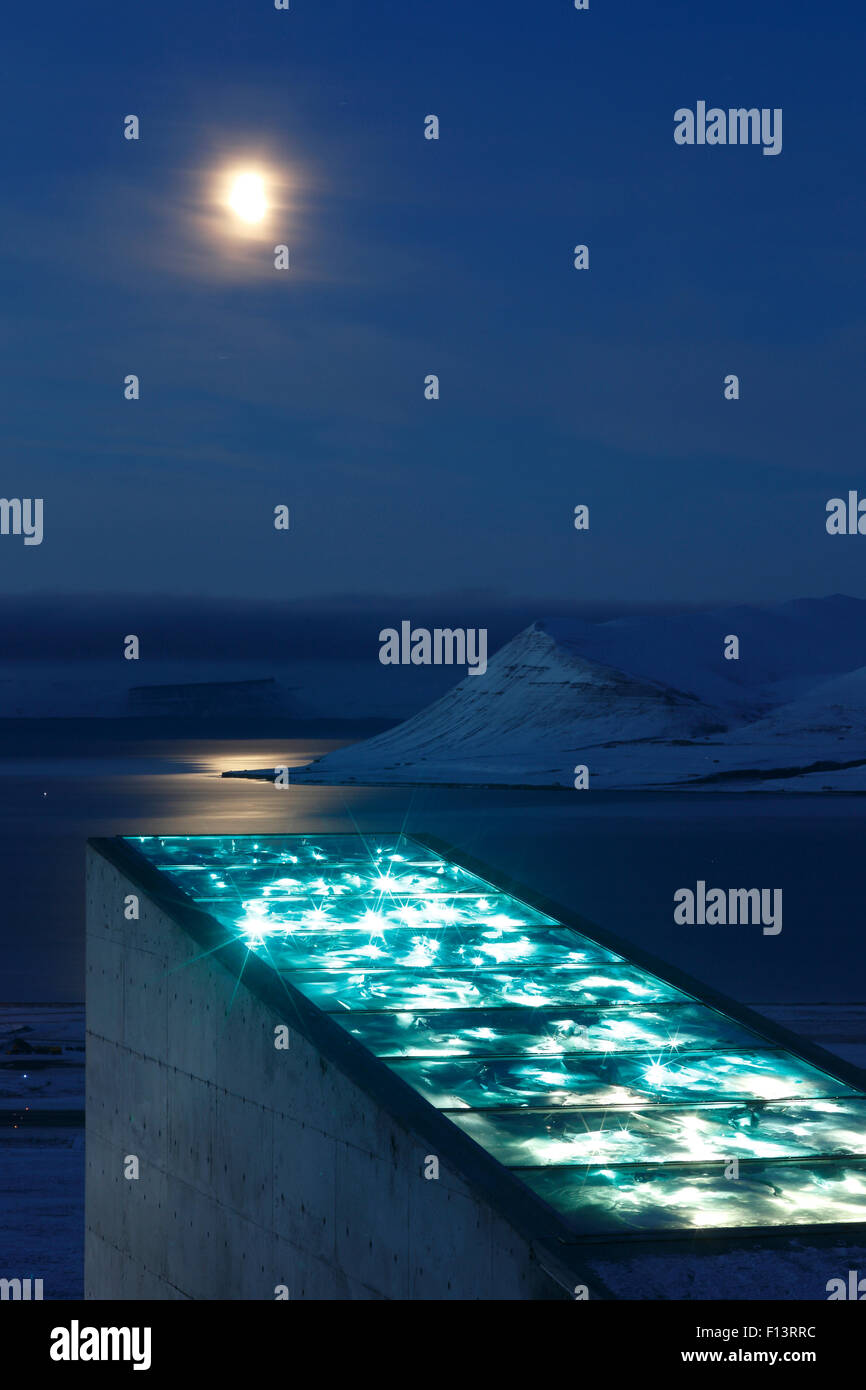 Moon and glittering facade designed by artist Dyveke Sanne, on the roof of the Svalbard Global Seed Vault. Light reflected in steel, mirrors, and prisms in landscape, Svalbard, Norway, October 2012 Stock Photo