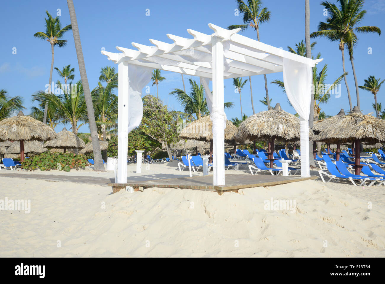 white wooden simple gazebo on a beach in the tropics Stock Photo