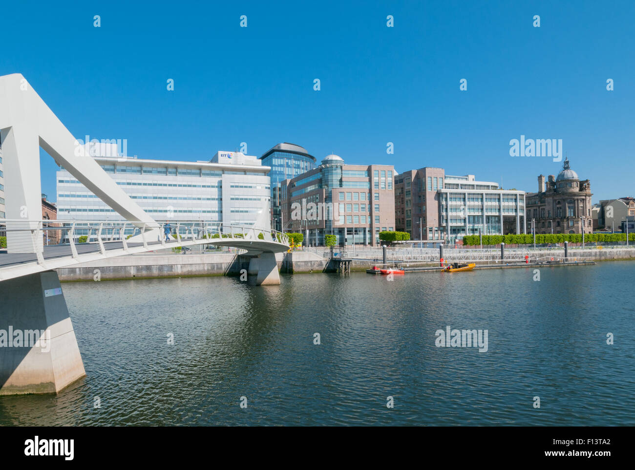 Modern buildings beside the River Clyde City of Glasgow with Tradeston Pedestrian Bridge Scotland Stock Photo