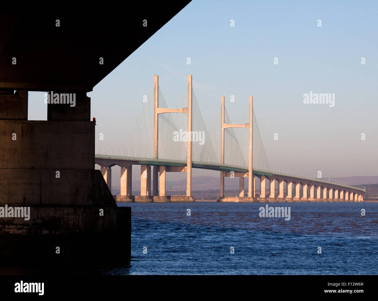 The second severn crossing bridge,M4 motorway, with a full tide just after sunrise from aust on the english side of the river severn, UK Stock Photo