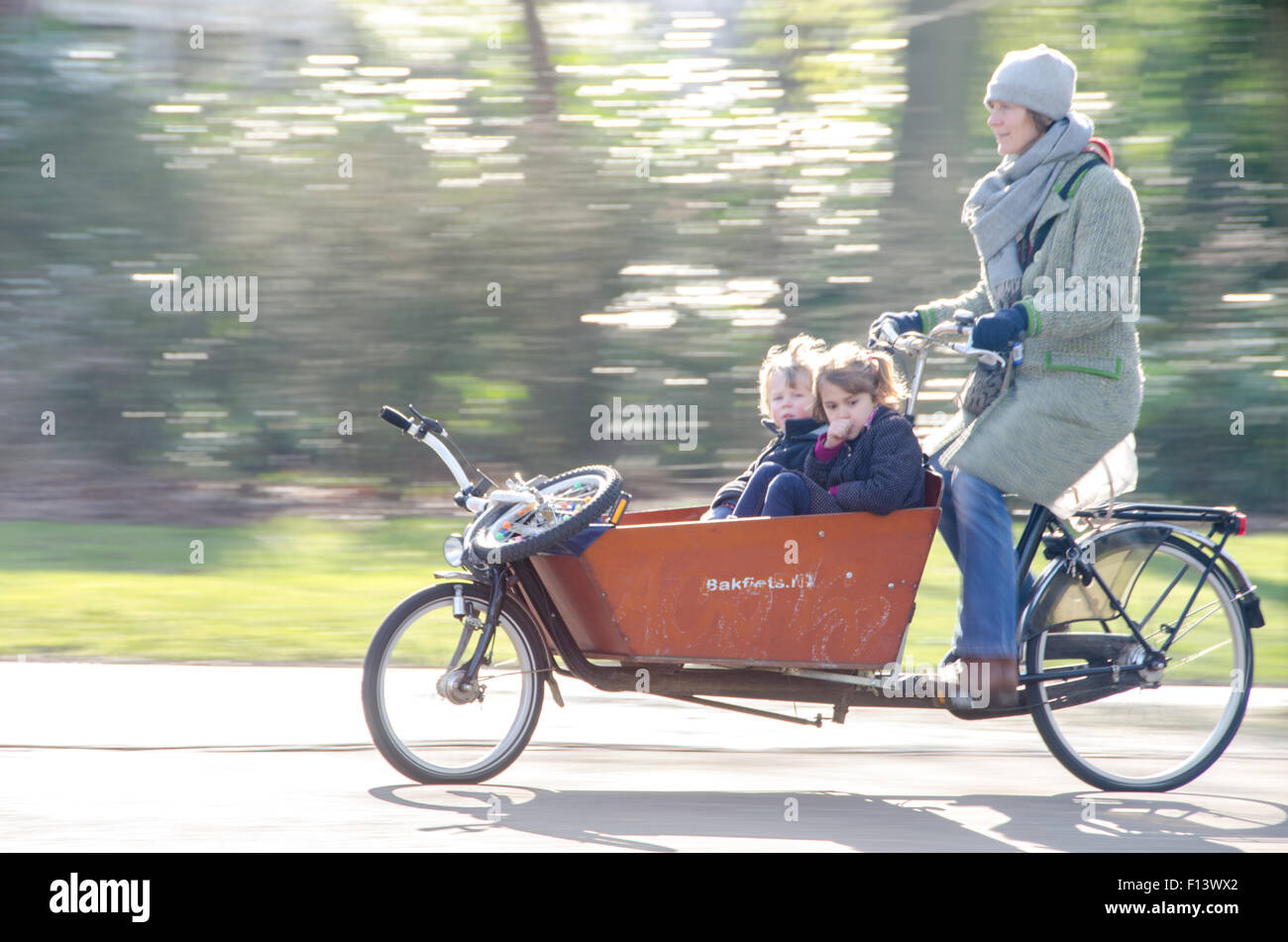 People riding a bike in Amsterdam Stock Photo Alamy