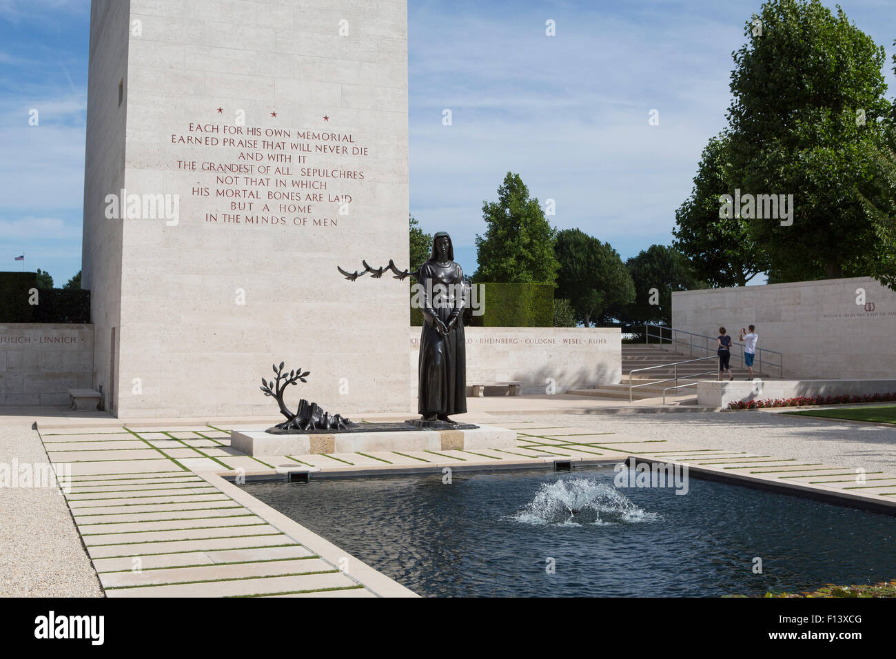 Entrance of the Netherlands American Cemetery and Memorial with a pond and the memorial tower Stock Photo