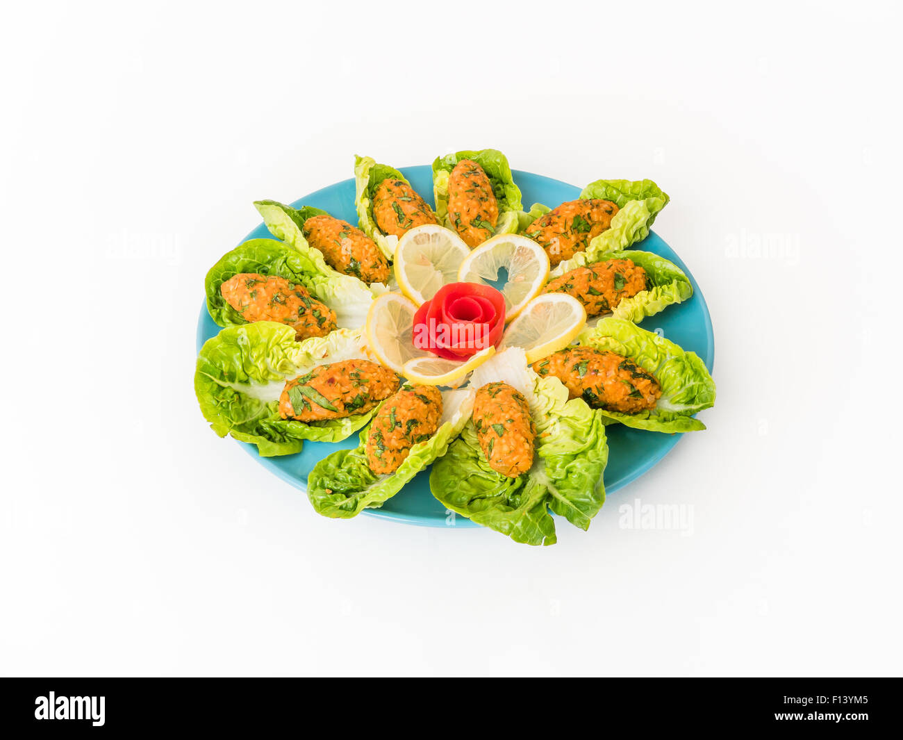 Lentil patties mediterranean mezze salad with lettuce isolated on white background Stock Photo
