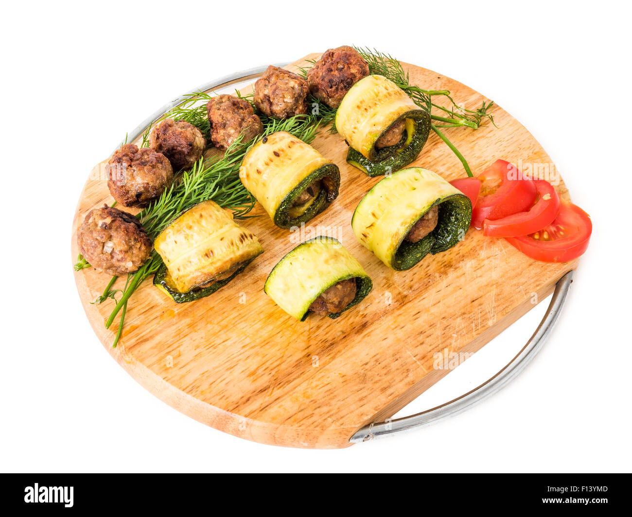 Meatball kofte appetizers mediterranean mezze food with marrow, on a wood dish isolated on white studio background Stock Photo