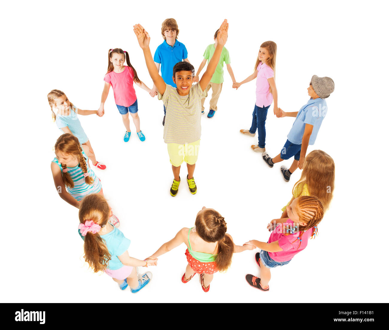 Asian boy in circle of other kids Stock Photo