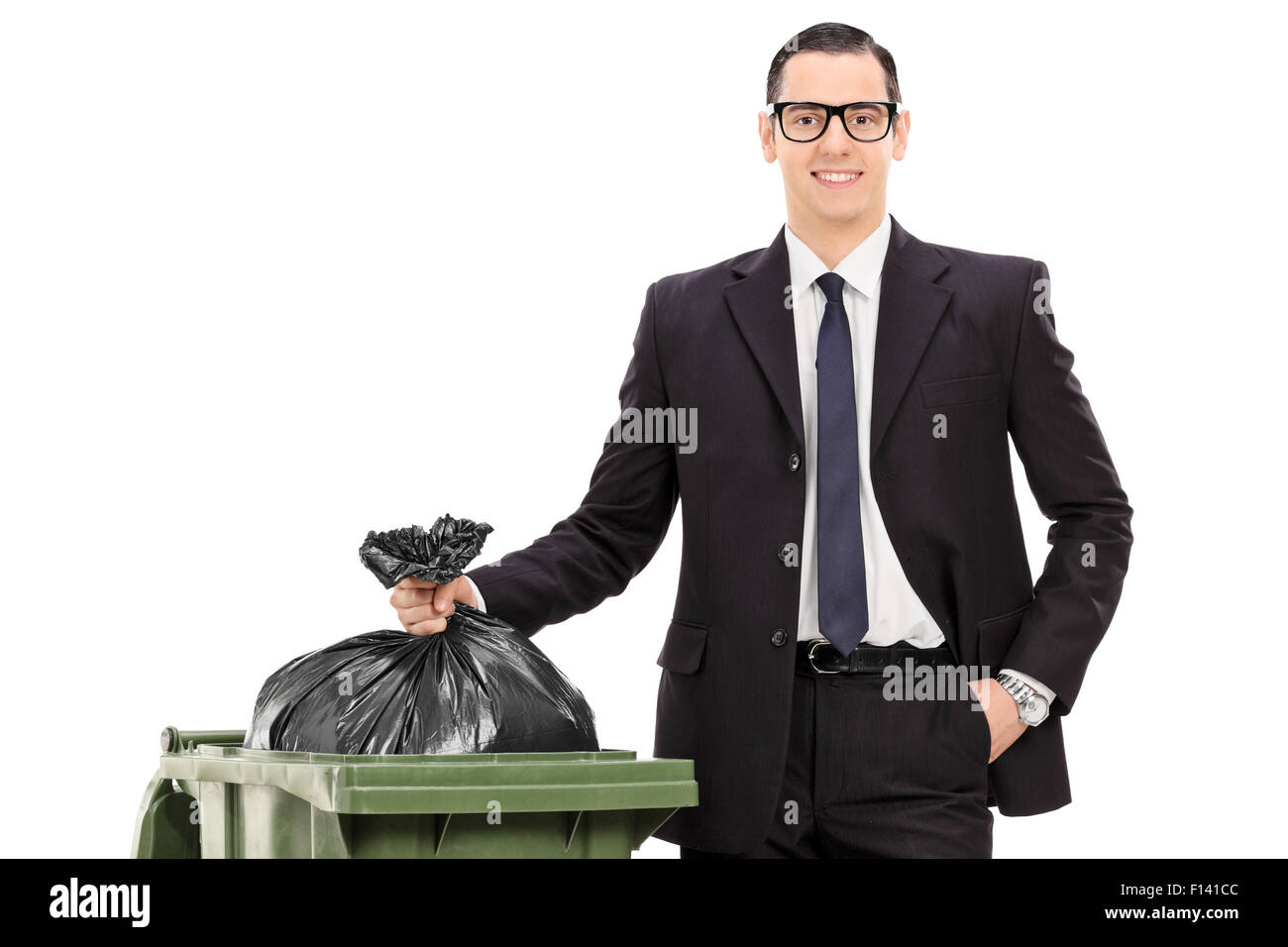 young businessman taking out the trash isolated on white background Stock Photo