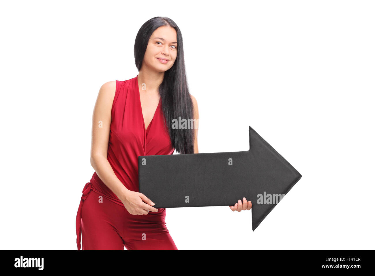 Young fashionable woman holding a big black arrow pointing right ...