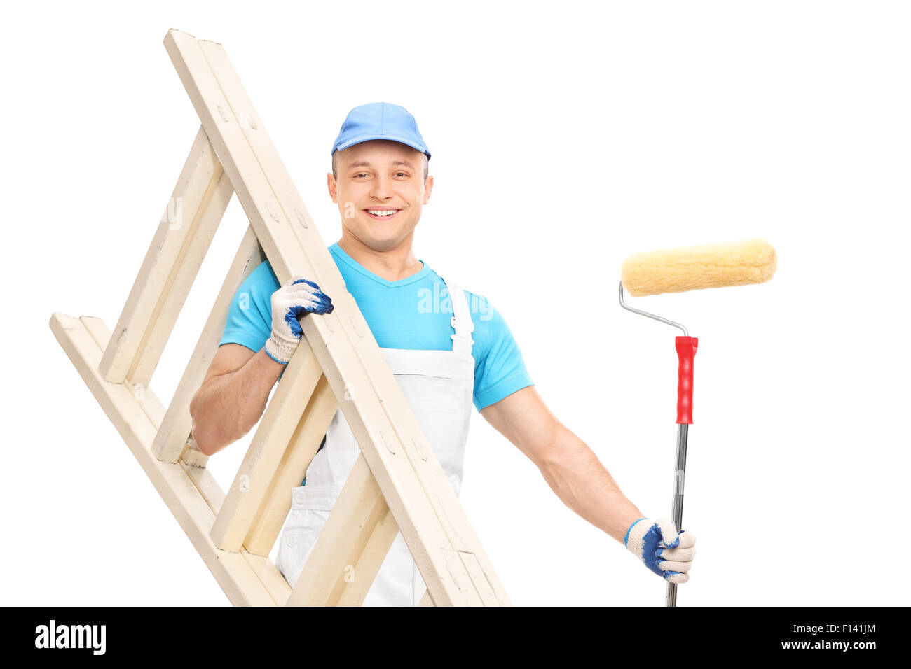 Young house painter holding a paint roller and a wooden ladder isolated