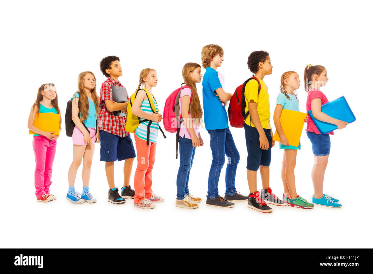 School kids with backpacks and textbooks Stock Photo