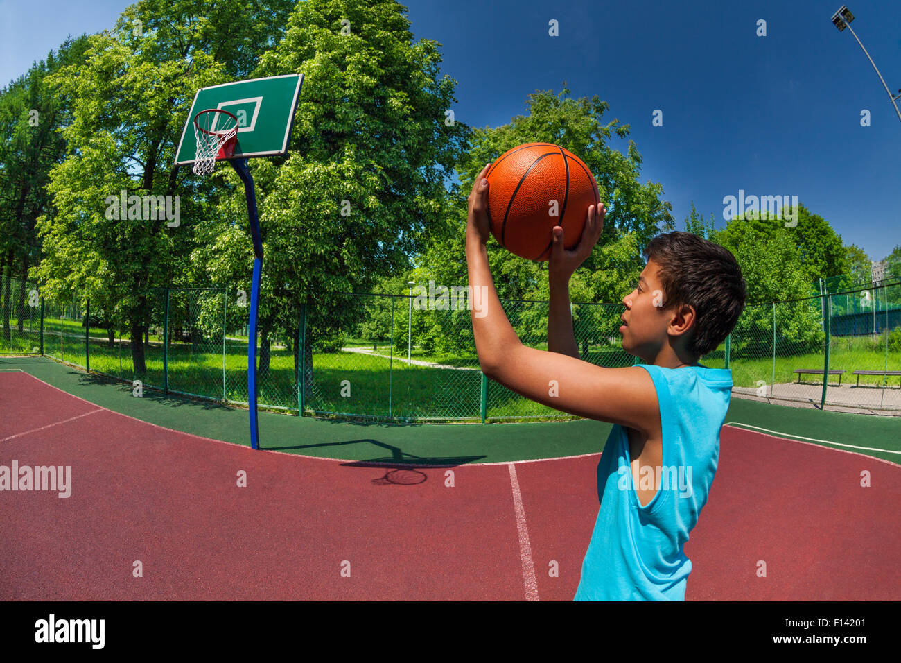 Arabian Boy Throwing Ball In Basketball Goal Stock Photo Alamy