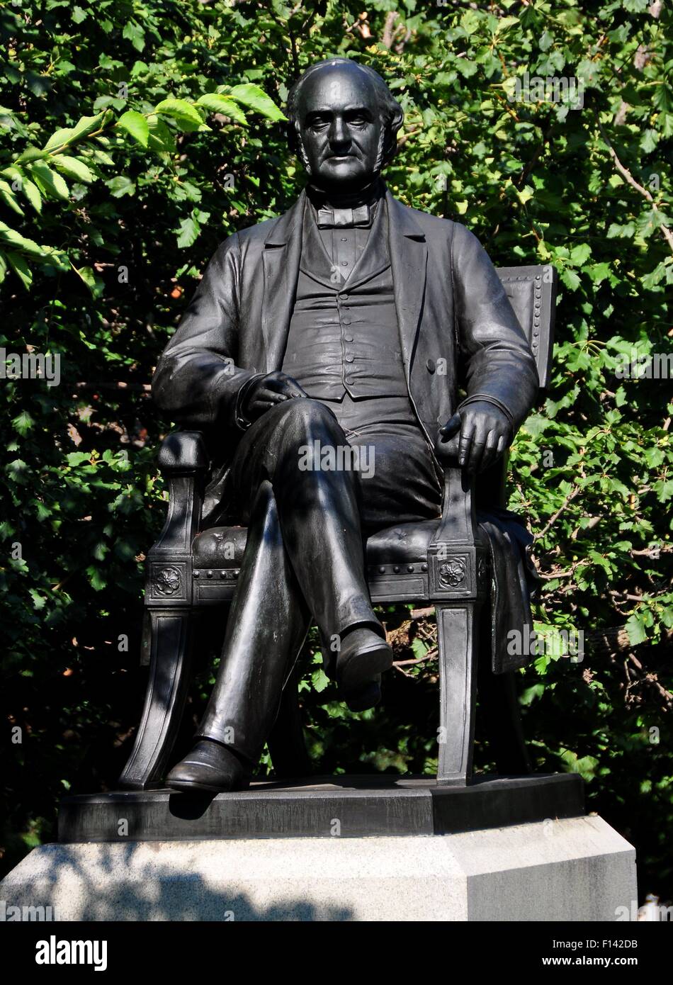 Baltimore, Maryland:  Statue of  philanthropist George Peabody seated in a chair stands in Mount Vernon Place Stock Photo