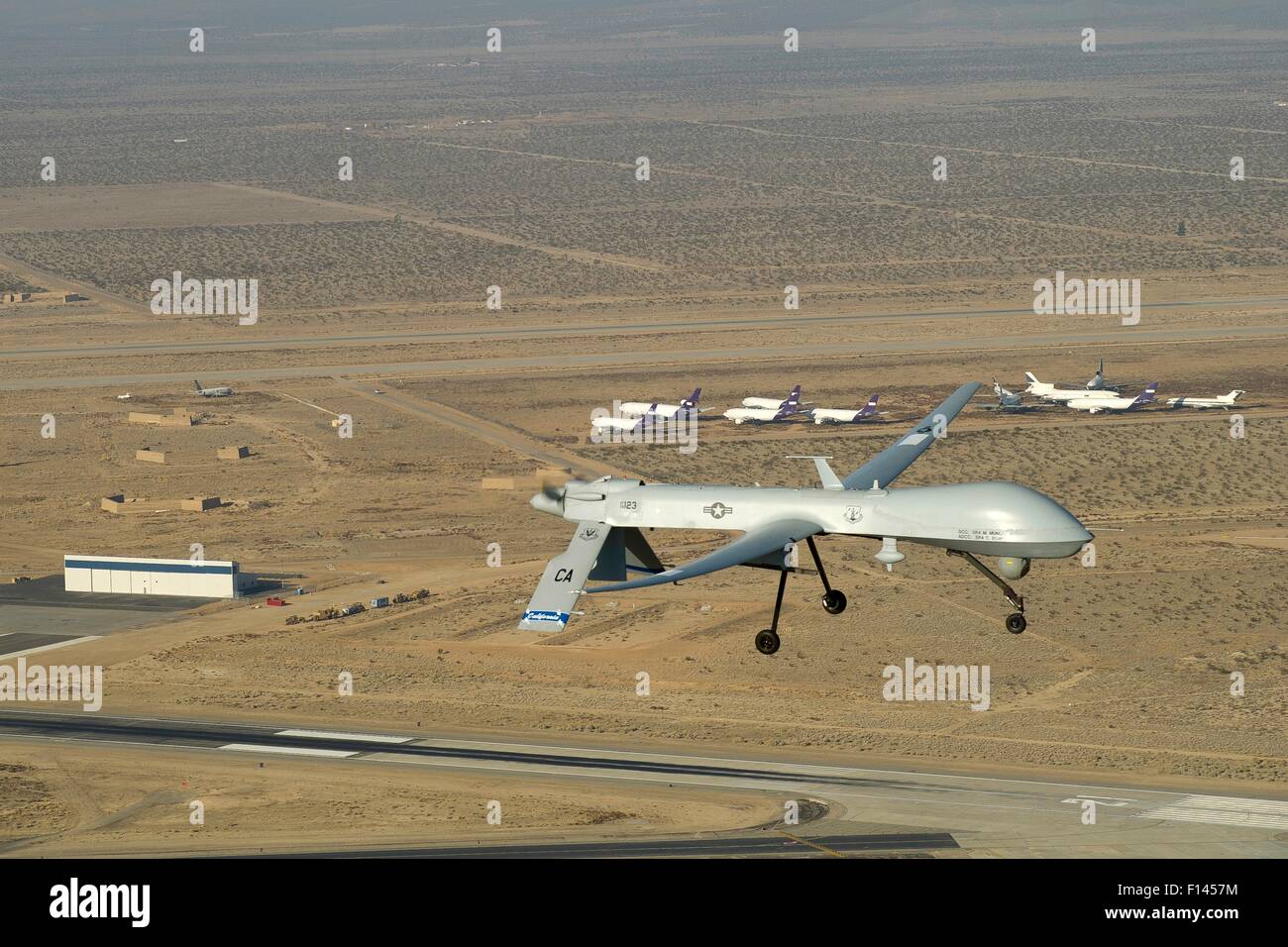 US Air Force MQ-1 Predator unmanned aerial vehicle assigned to the California Air National Guard's 163rd Reconnaissance Wing in flight over Southern California January 13, 2012 in Victorville, CA. Stock Photo