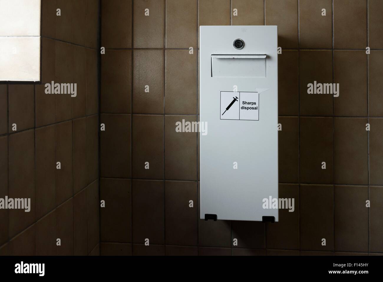 Needle disposal bin for drug users, in public toilet Stock Photo Alamy