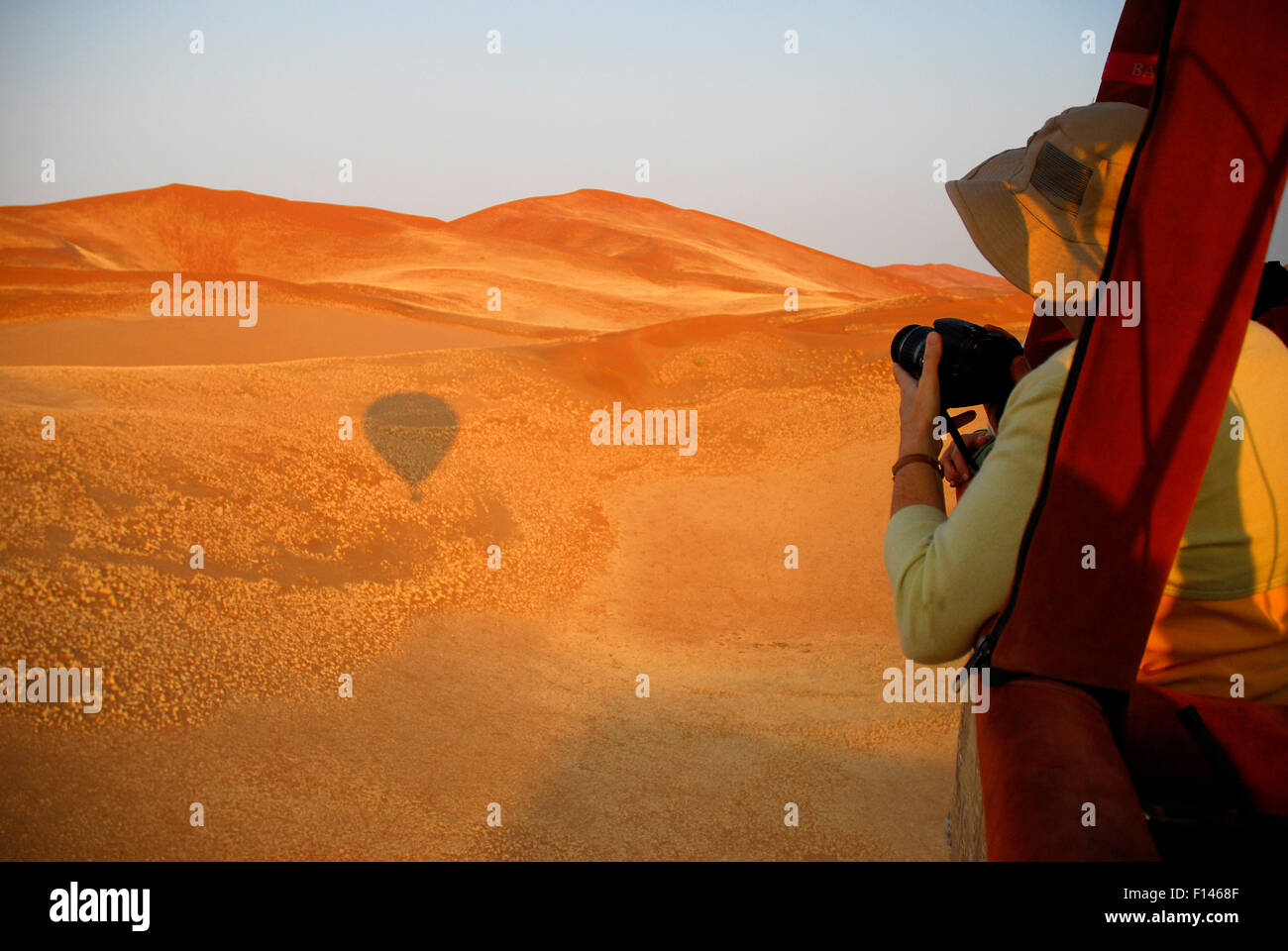 Tourists taking photos from hot air balloon ride over the Namib desert, Namibia, February 2005. Stock Photo