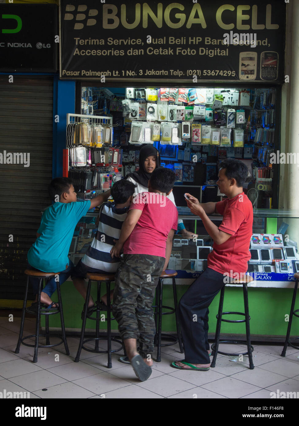 Mobile phone stall in a market place in Jakarta, Indonesia Stock Photo