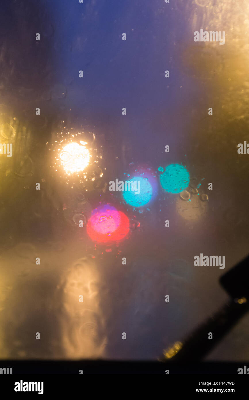 Rain falling on windshield with blurry bokeh Stock Photo Alamy