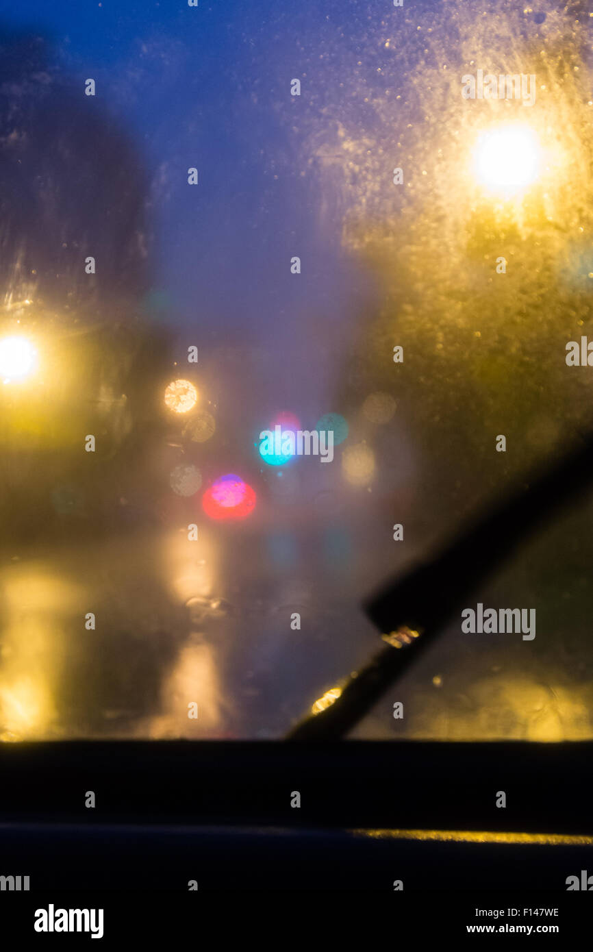 Rain falling on windshield with blurry bokeh Stock Photo Alamy