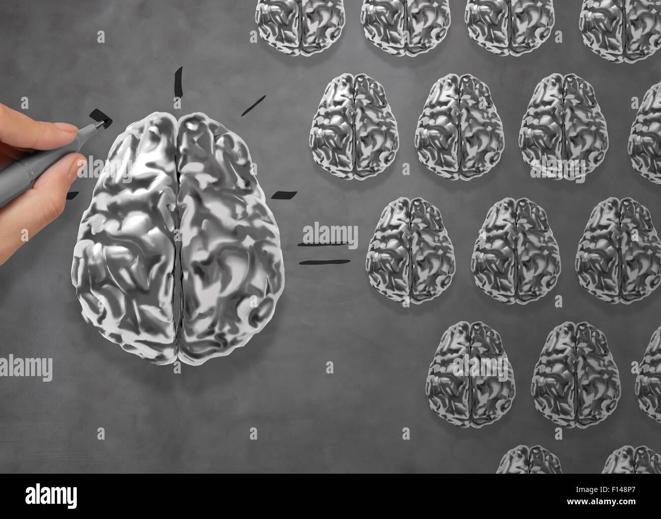 hand draws 3d metal brain asTeamwork concept Many small brains equal a big one. Stock Photo