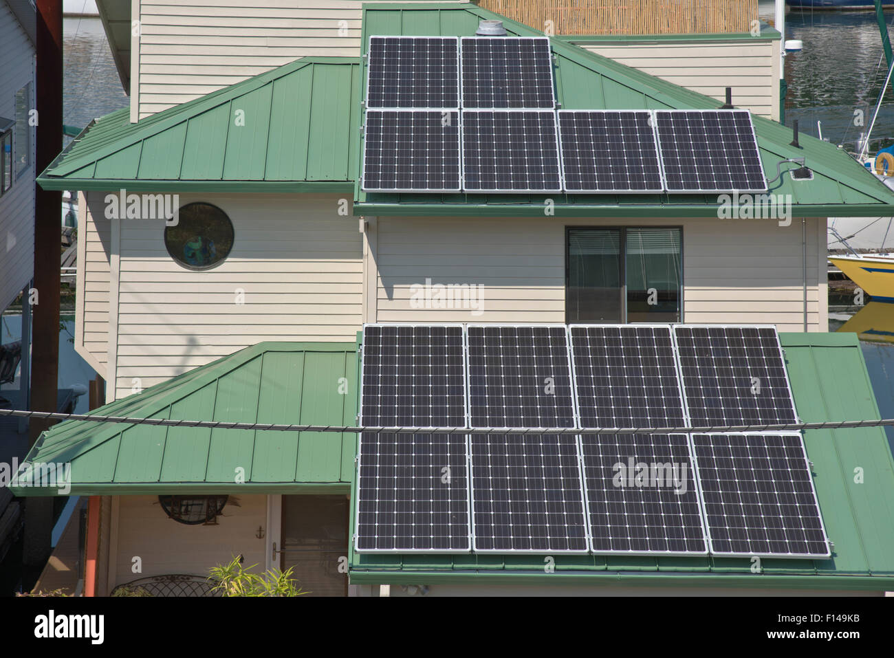 Solar panels on rooftops on a floating house Portland Oregon. Stock Photo
