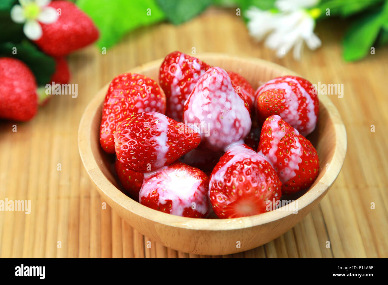 Strawberries with condensed milk Stock Photo