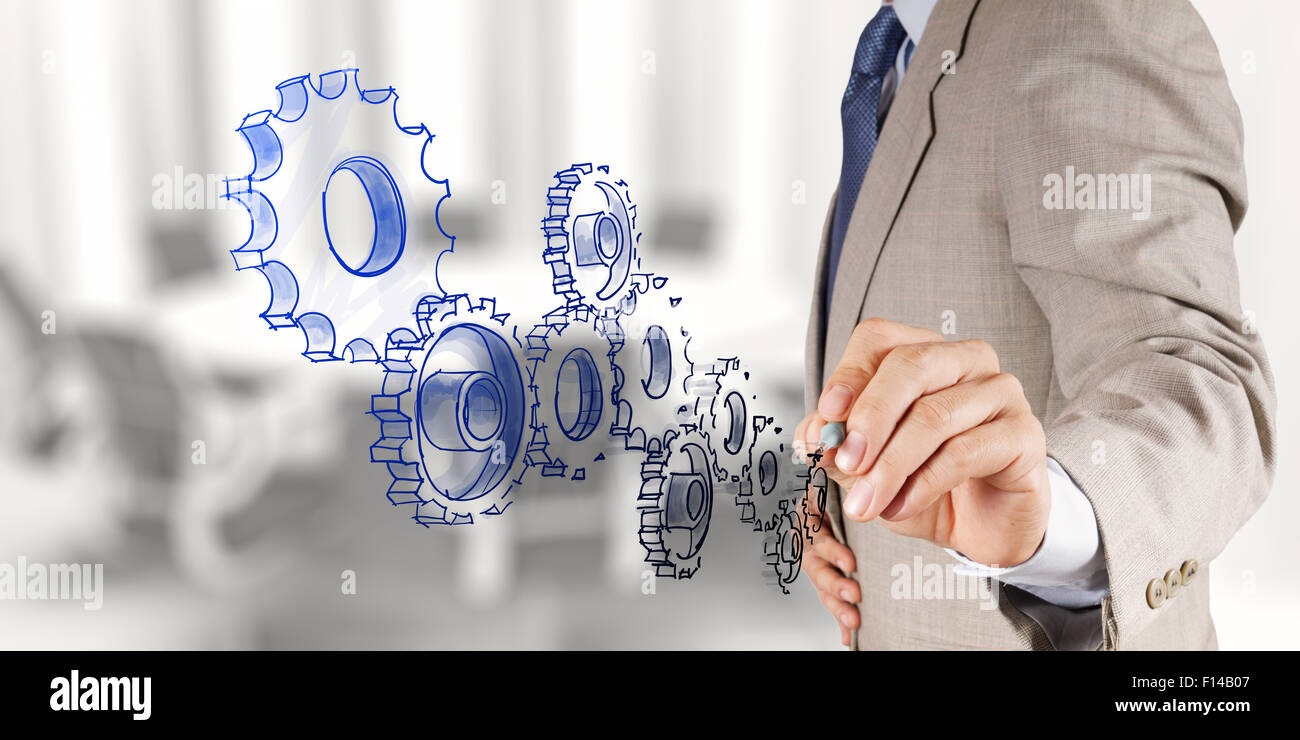 businessman hand draws gear to success concept Stock Photo - Alamy