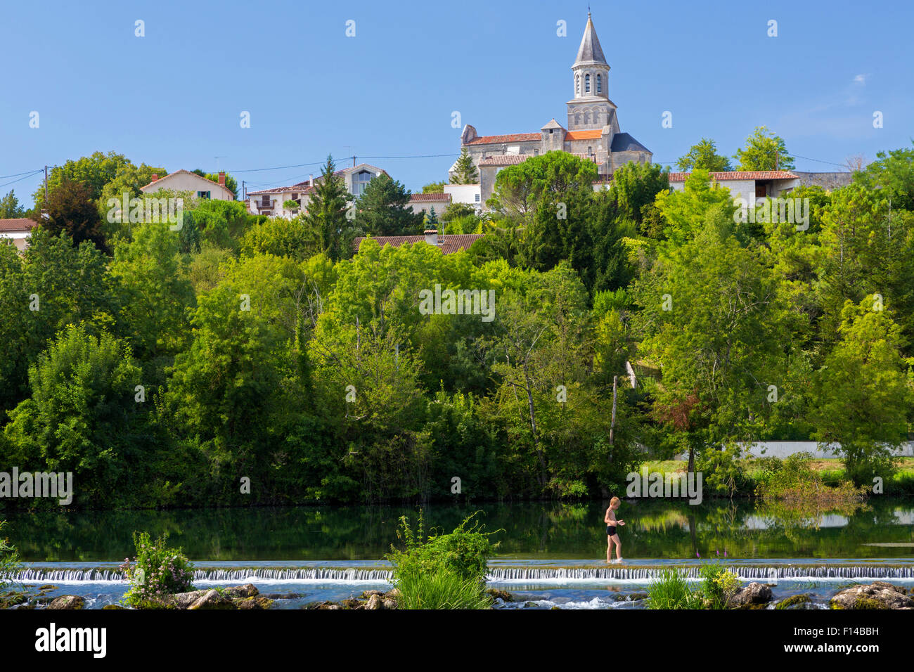 St. Simeux church and river, Mosnac, Poitou Charentes, Charente Maritime, France Stock Photo