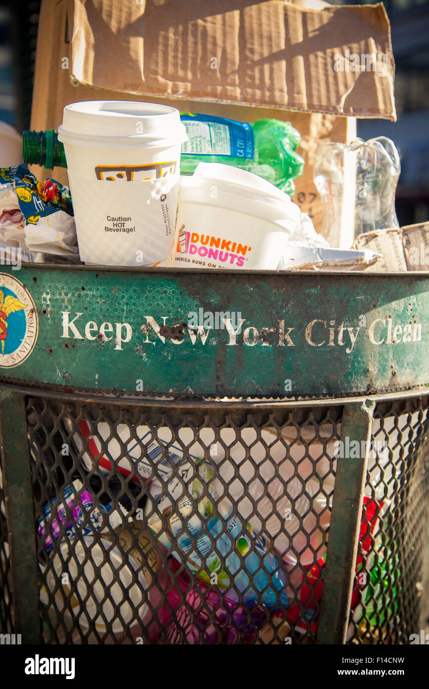 Full trash can in New York City Stock Photo