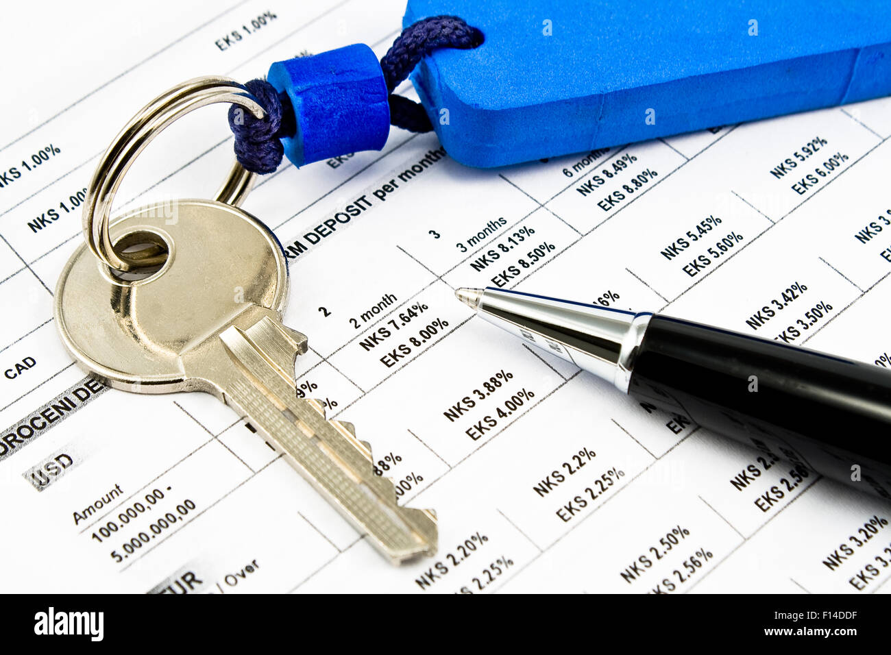 Pen, House key and Interest rates on bank loans Stock Photo