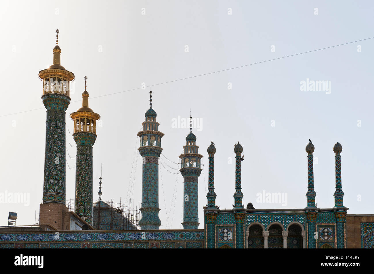 Colorfully ornamented minarets, Shrine of Fatima Masuma, Qom, Iran Stock Photo