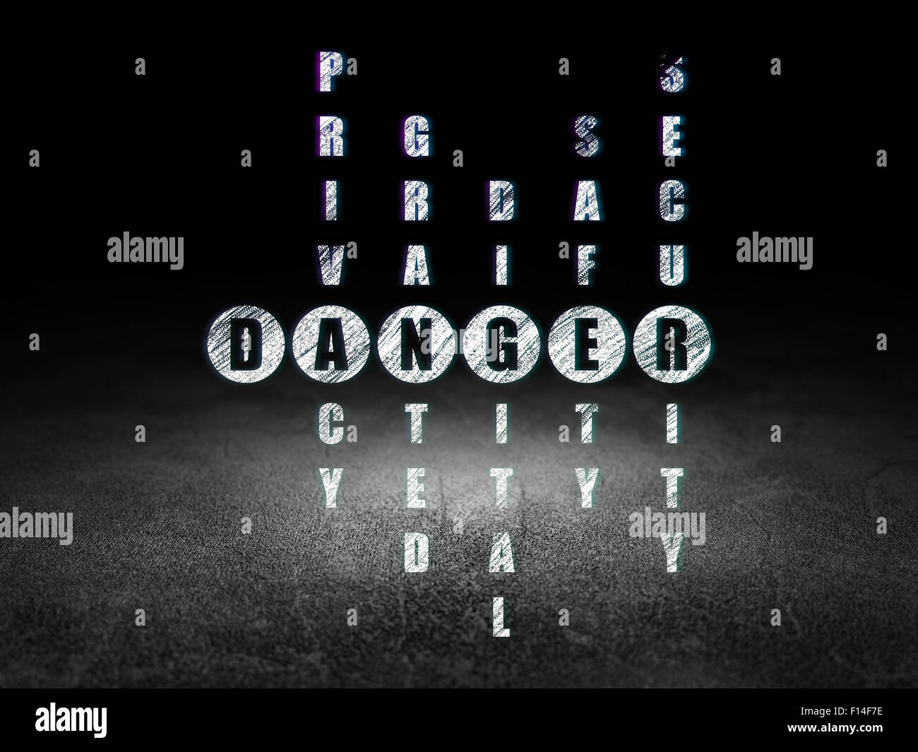 Privacy concept word Danger in solving Crossword Puzzle Stock Photo