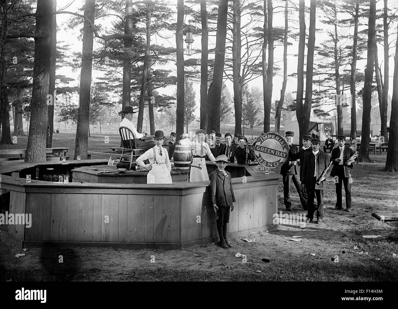 1890s TURN OF THE CENTURY BAND AT FESTIVAL STAND IN WOODED PARK AREA Stock Photo