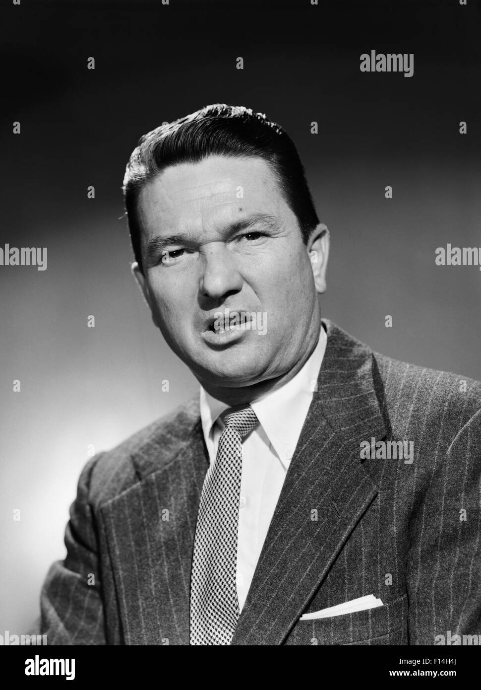 1950s BUSINESSMAN IN SUIT MAKING FUNNY SERIOUS FROWN FACIAL EXPRESSION ...