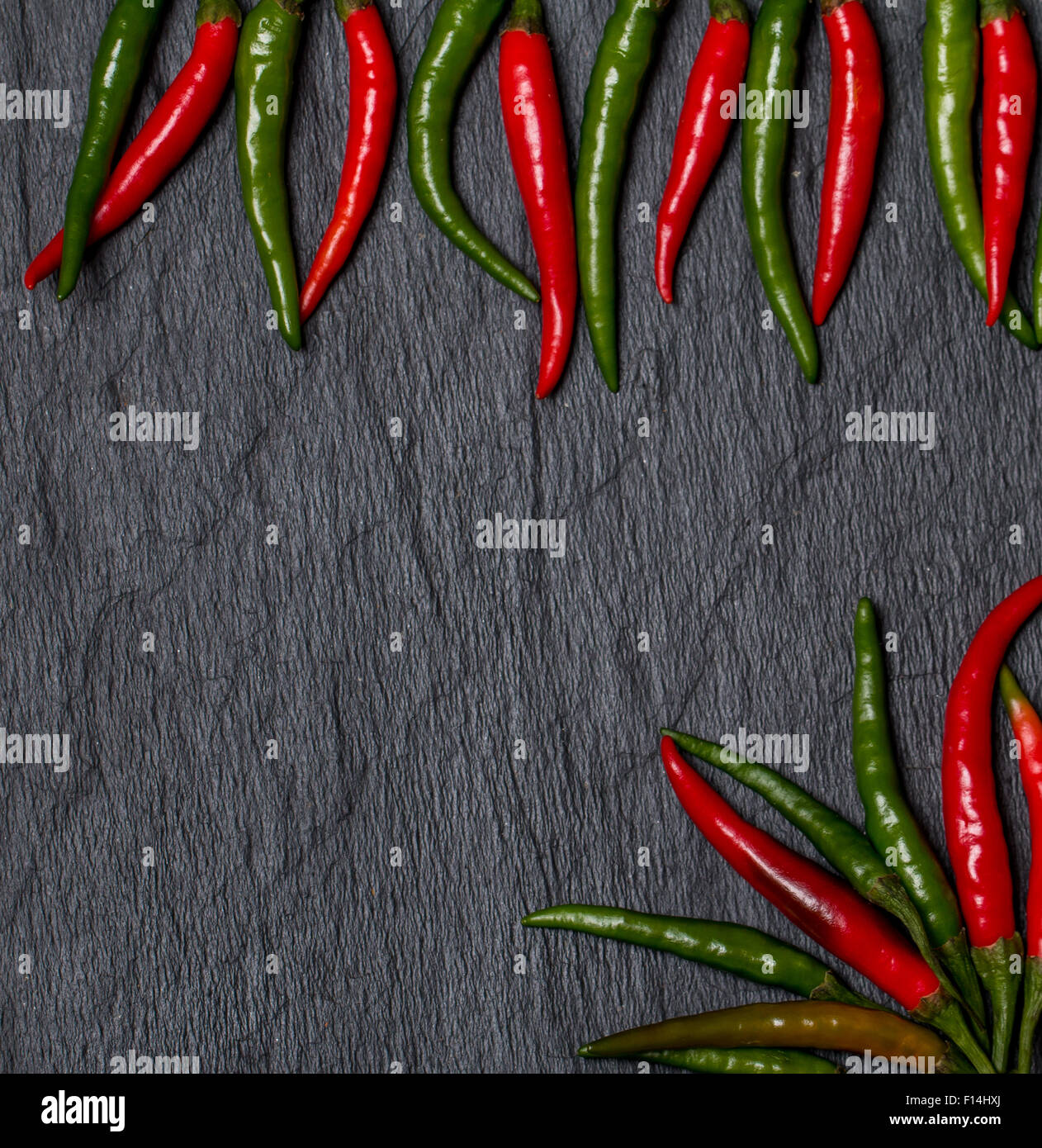 frame of red and green Chile pepper on black background Stock Photo - Alamy