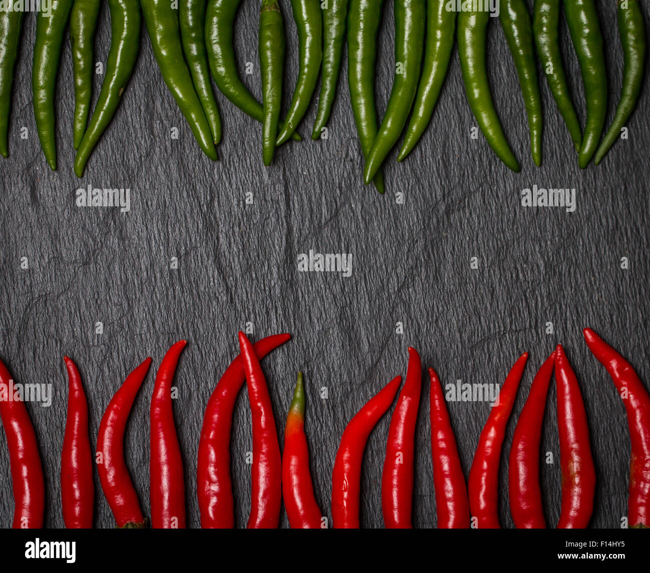 frame of red and green Chile pepper on black background Stock Photo - Alamy