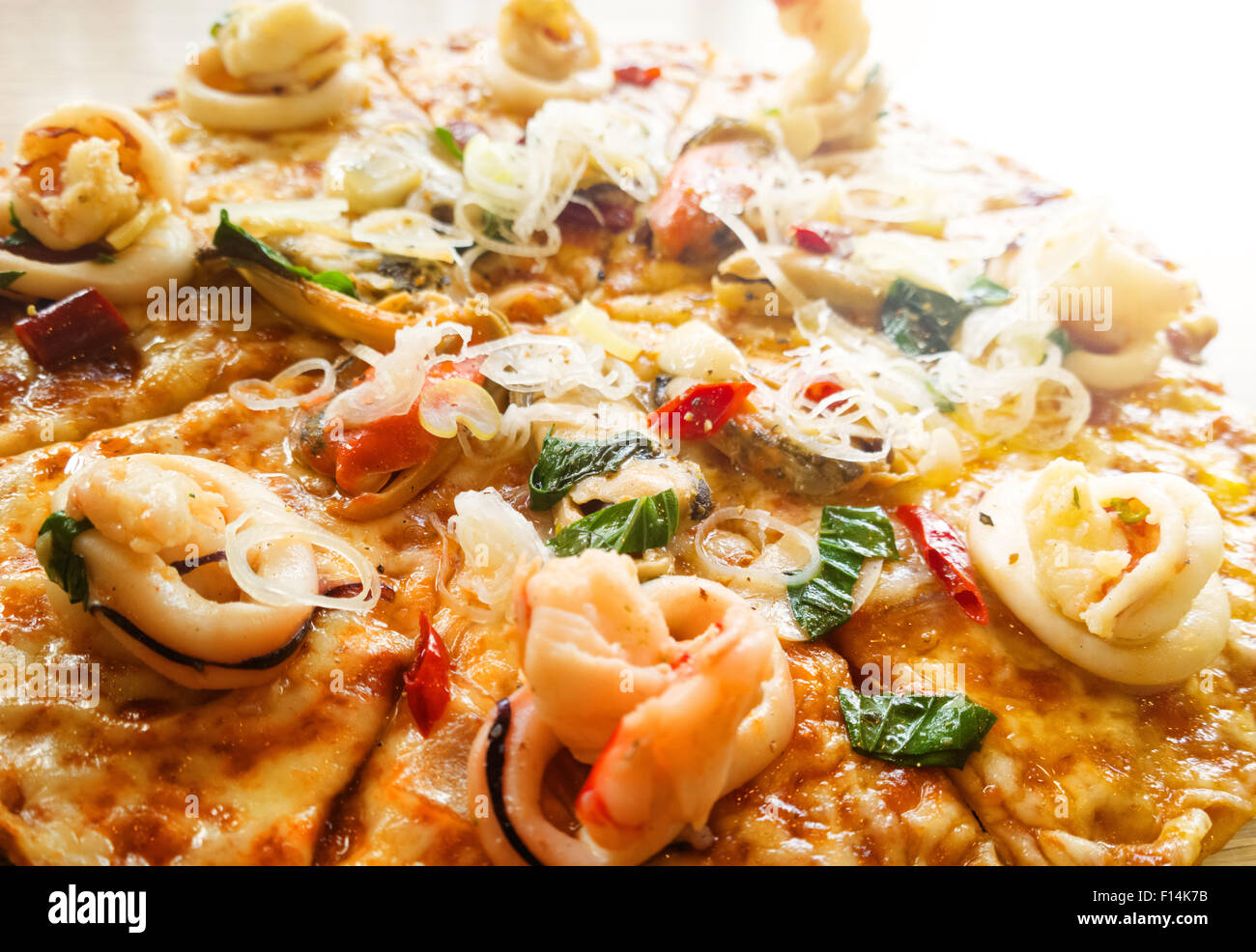 Seafood spicy pizza on wood table Stock Photo Alamy
