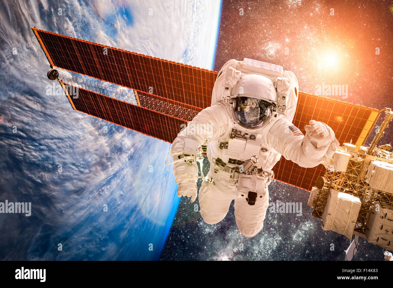 International Space Station and astronaut in outer space over the